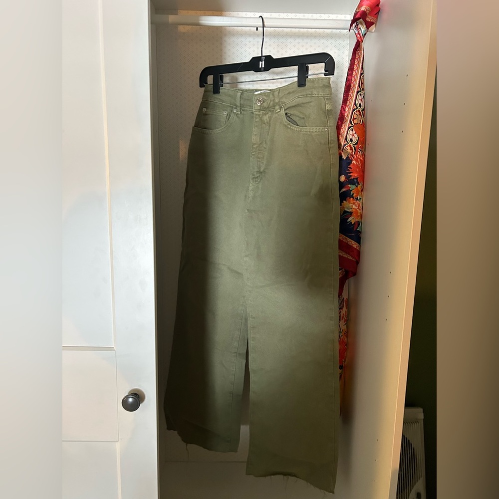 US size 6 green jean with rough cut hems